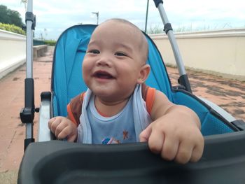 Portrait of cute boy in stroller