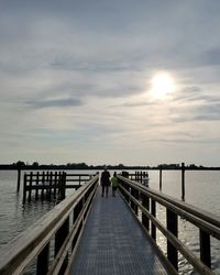 Scenic view of pier over sea against sky