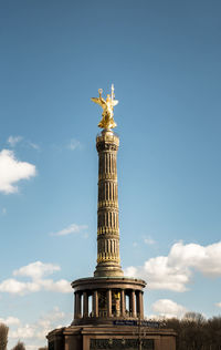 Low angle view of statue of liberty against sky