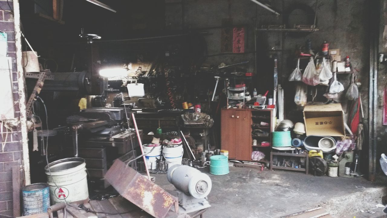 indoors, abandoned, built structure, messy, obsolete, old, architecture, wall - building feature, large group of objects, no people, chair, damaged, industry, factory, day, garbage, run-down, store, absence, building exterior