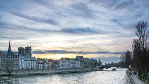 Buildings against cloudy sky
