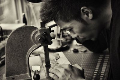 Young woman playing with arms raised