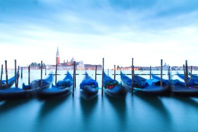 Boats moored in sea