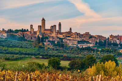 View of buildings in city at sunset