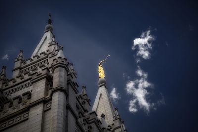 Low angle view of statue against cloudy sky