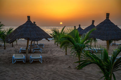 Scenic view of beach against sky during sunset