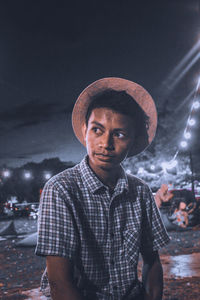 Portrait of young man wearing hat