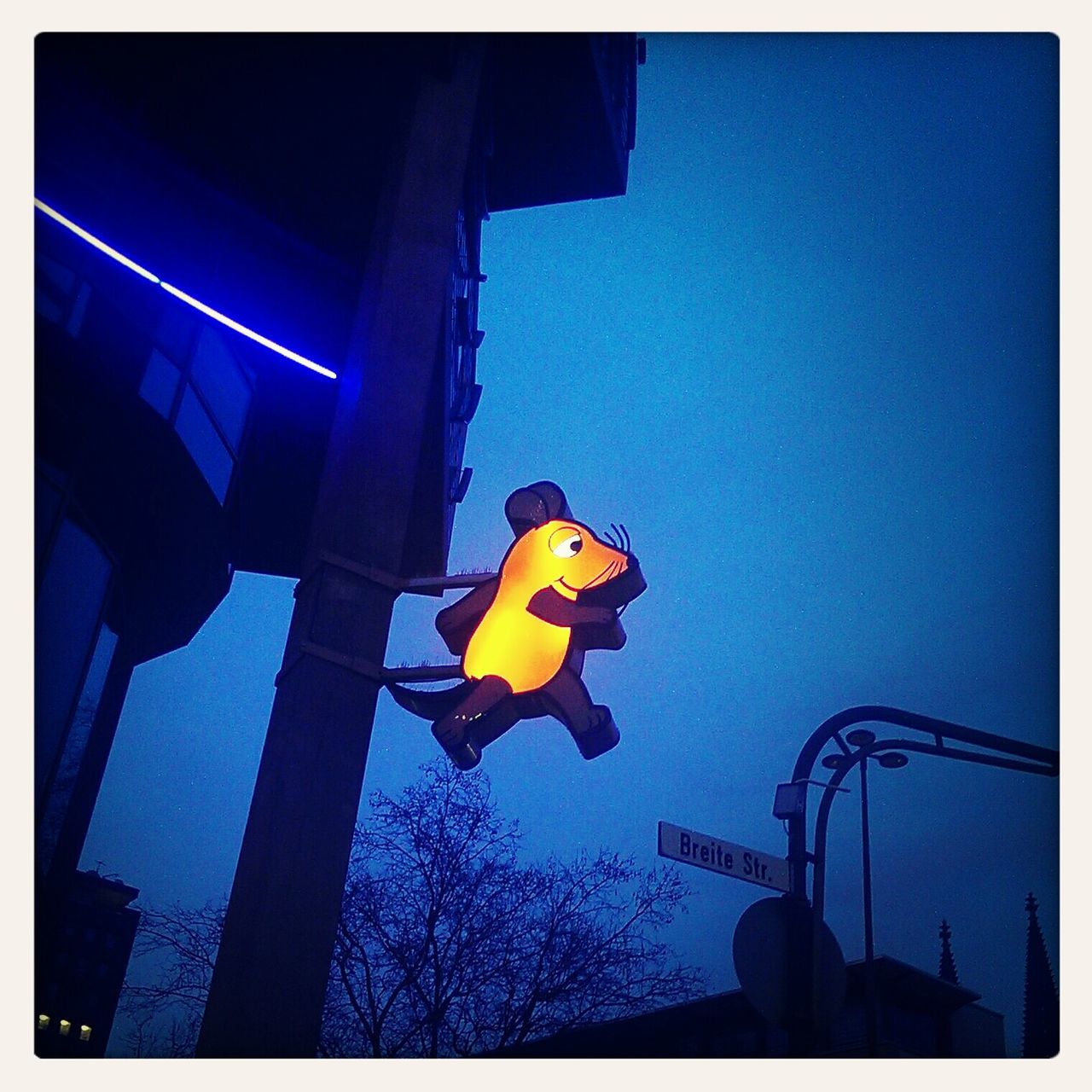 transfer print, low angle view, auto post production filter, built structure, clear sky, architecture, illuminated, building exterior, street light, blue, lighting equipment, yellow, night, transportation, city, outdoors, copy space, connection, sky, no people