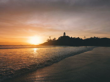 Scenic view of sea against sky during sunset