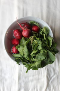 High angle view of strawberries in bowl on table