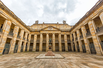 Statue of historic building against sky