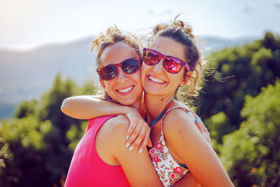 Portrait of smiling woman wearing sunglasses