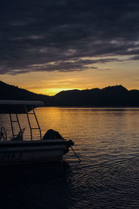 Scenic view of lake against cloudy sky