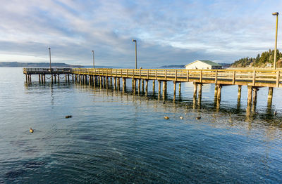 Empty wooden pier at redondo beach, washington.