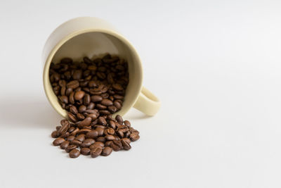 Close-up of coffee beans against white background