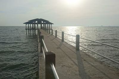 Pier over sea against sky