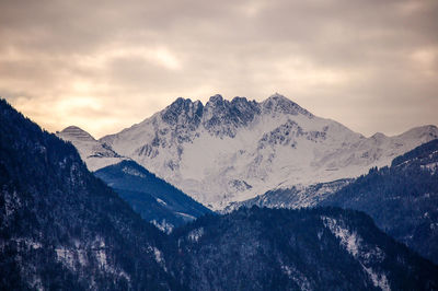 Scenic view of snowcapped mountains against sky