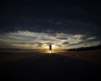 People on beach at sunset