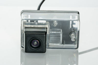 Close-up of camera on white background