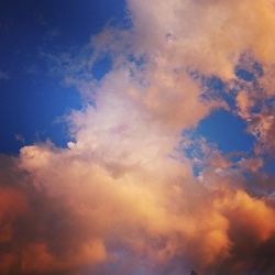 Low angle view of cloudy sky at sunset