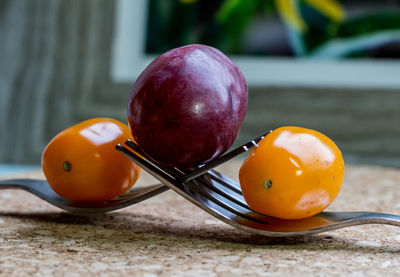 Close-up of oranges on table