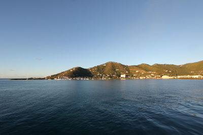 Scenic view of sea against blue sky