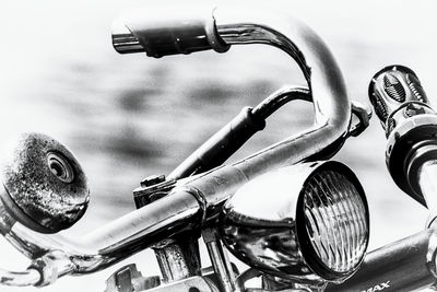 Close-up of motorcycle against sky