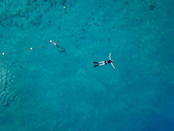 High angle view of airplane flying over sea