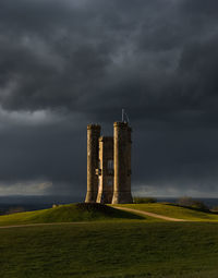 Broadway tower against  stormy sky