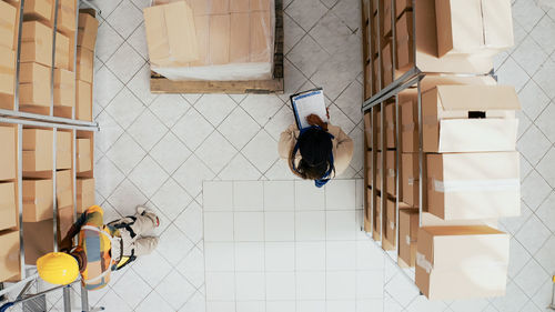 High angle view of woman standing in bathroom