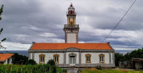 Tower of historic building against sky