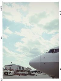 Cropped image of train against cloudy sky