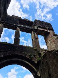 Low angle view of old ruin against sky