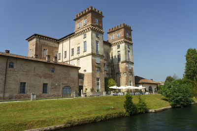 Low angle view of buildings against blue sky