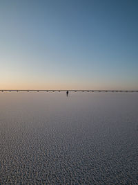 Scenic view of sea against clear sky during sunset