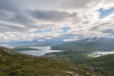 Scenic view of landscape and mountains against sky