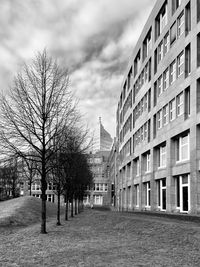 Street amidst buildings in city against sky