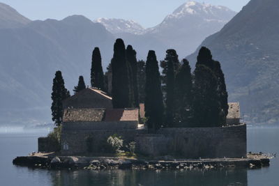 Panoramic view of building and mountains against sky