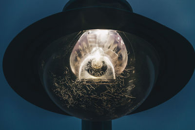 Low angle view of illuminated light bulb