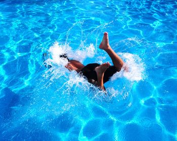 Man swimming in pool