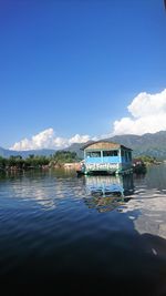 Scenic view of lake against blue sky