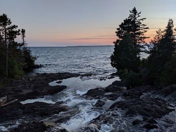 Scenic view of sea against sky during sunset