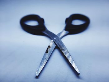 Close-up of scissor object on table