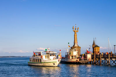 Nautical vessel on sea against clear sky