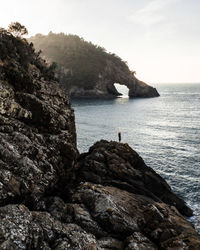 Scenic view of sea against the cave