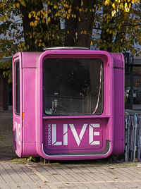 Pink kiosk where you can buy tickets for various events