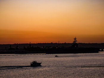 Scenic view of sea against orange sky