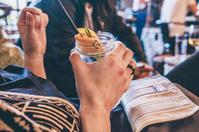 Close-up of hand holding cocktail glass