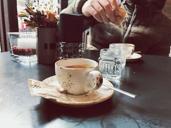 Close-up of coffee cup on table