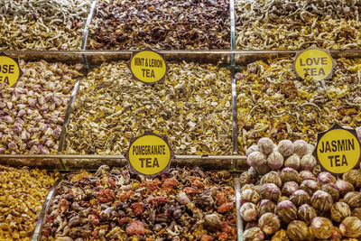 Close-up of various herbal teas with tags at spice bazaar